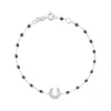 Bracelet noir Fer à cheval, diamants, or blanc, 17 cm